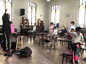 Children in class with drumsticks