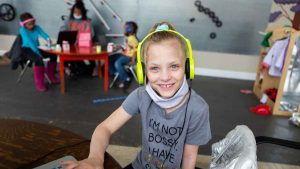 Young girl using a learning pod